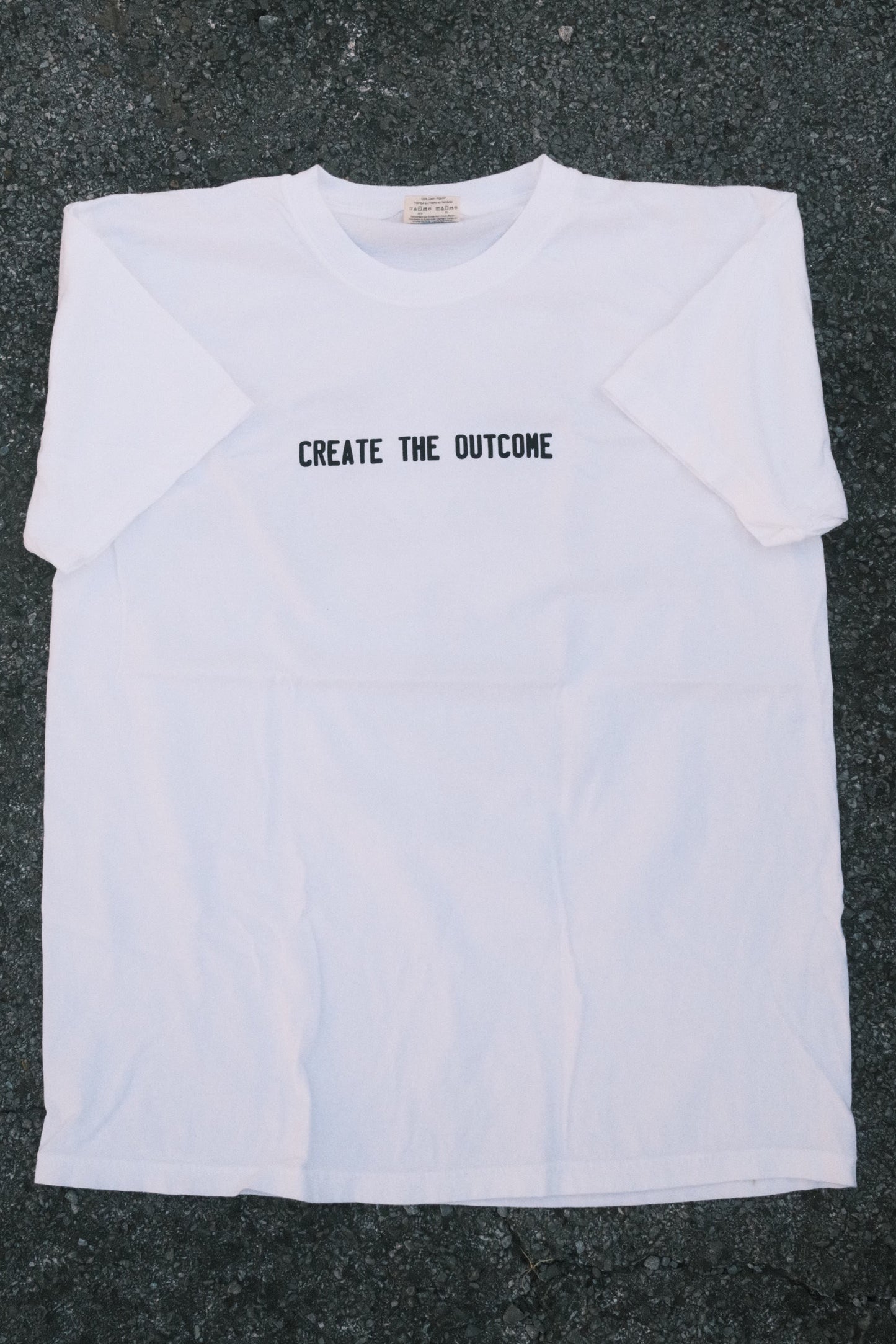 WHITE CREATE THE OUTCOME SHIRT
