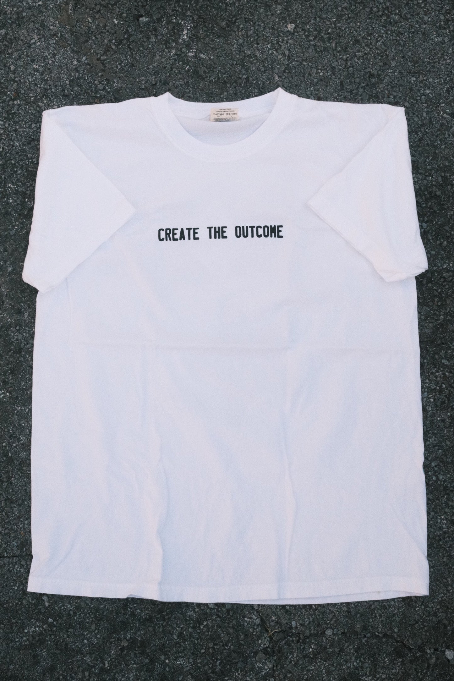 WHITE CREATE THE OUTCOME SHIRT